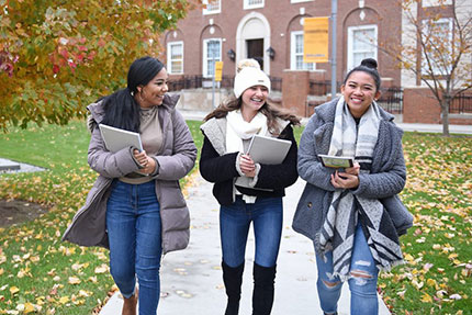 Students walking on campus. Link to Gifts That Pay You Income